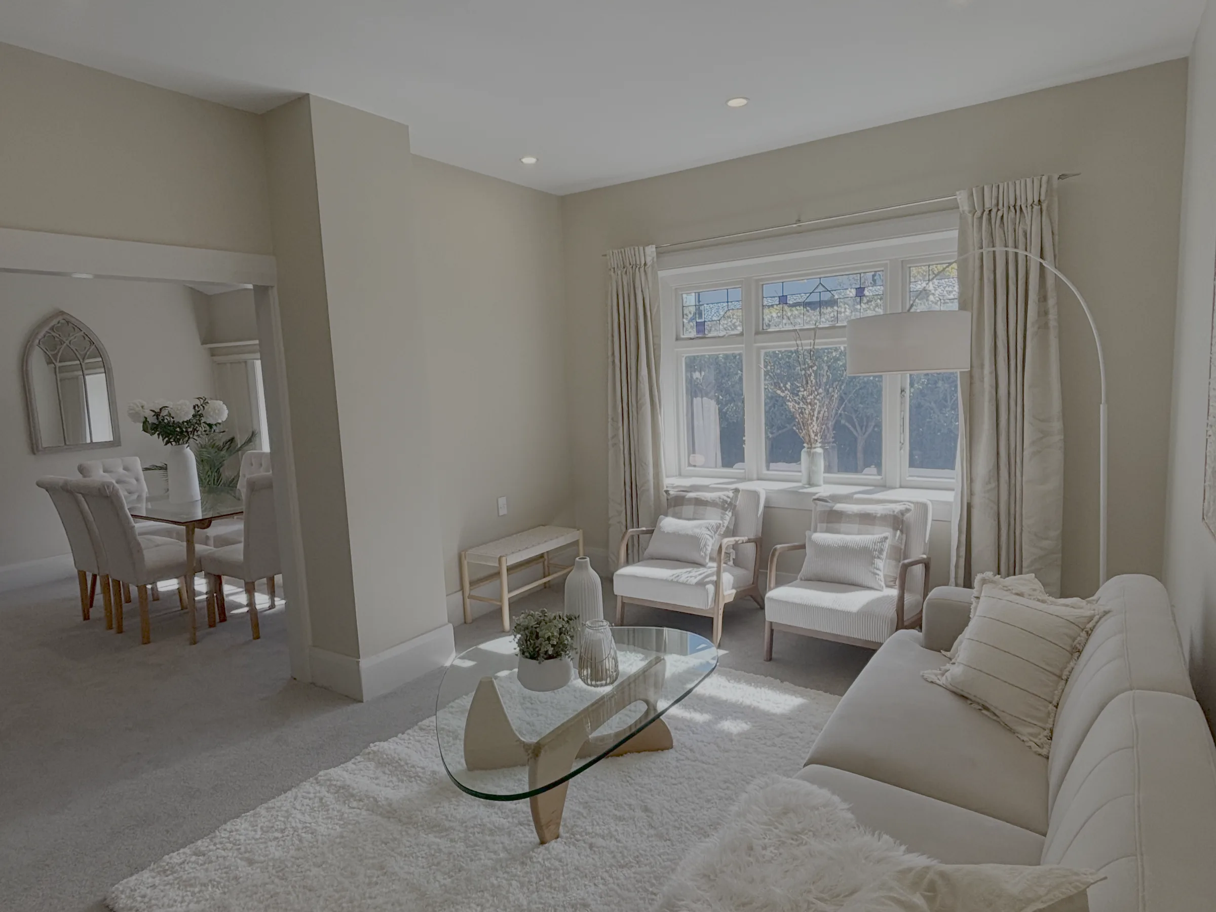 Freshly painted open-plan living room in warm neutral tones